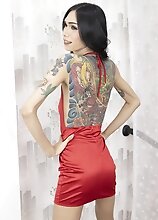 Horny ladyboy Boyo is ready to show what she got. Her tattooed slim body, small tits and ripe ass make this yummy treat you don't want to miss!