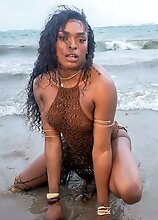 Black tgirl Naomi Whistledown likes to walk out to the beach. Then she comes home and plays with her big cock
