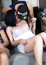 Busty Brunette gives a BlowJob while her girlfriends watch TV